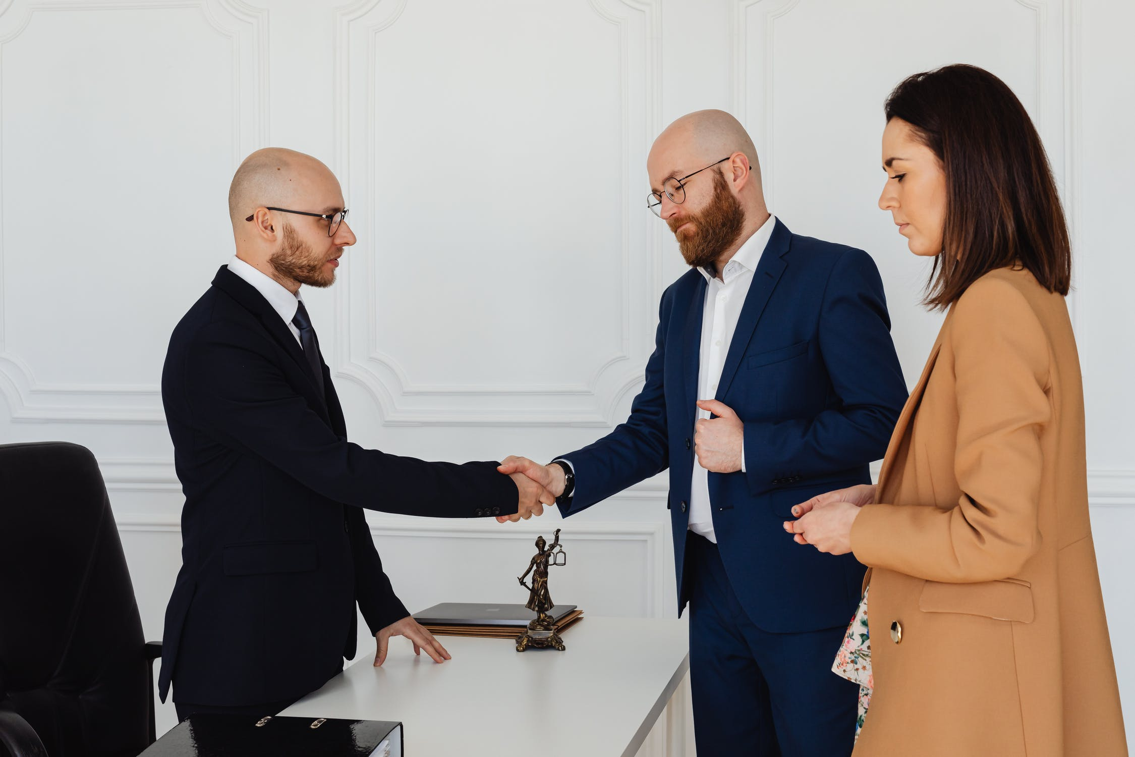 A lawyer talking to a client at his office about medical negligence and medical malpractice. A lawyer talking to a client at his office about medical negligence and medical malpractice.